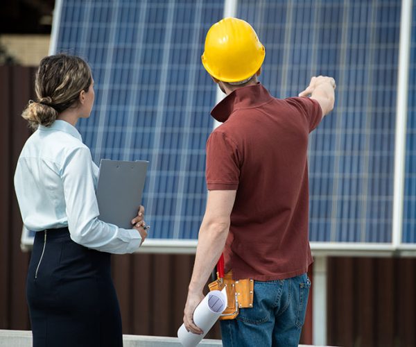 contractor-showing-installed-solar-panels-2021-09-24-03-45-07-utc